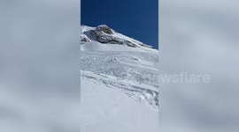 Skiier slams into snow while trying double backflip