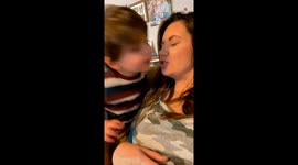 'Just Like Daddy' - Adorable baby boy does a thumbs up after giving mom a kiss