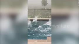 Large hail the size of BASEBALLS hits swimming pool in Texas