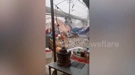 Fierce storm leaves market stalls in ruins following heat wave in Thailand