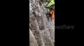 Daredevil goes viral with ‘best job in the world’- climbing rocks 980 ft in the air