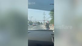 Kind driver stops and climbs down car to help old woman cross street