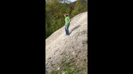 Woman falls hard face-first when trying to run down a slope
