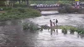 People strangled in the middle of the river were rescued by the fire staff in South India.