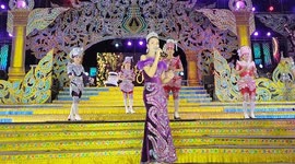 Performers in elaborate costumes perform on stage at an Isaan Mor Lam concert in Pattaya, Thailand