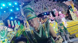 Performers in elaborate costumes perform on stage at an Isaan Mor Lam concert in Pattaya, Thailand