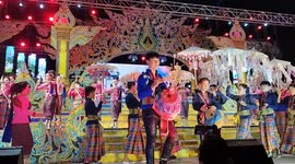 Performers in elaborate costumes perform on stage at an Isaan Mor Lam concert in Pattaya, Thailand