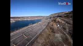 Aerial Drone Shot of a road ruined and taken over by Mother Nature