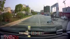 Man without helmet falls off bike and tumbles across road