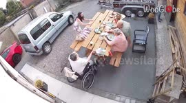 Table FLIPS on elderly couple during a family BBQ party