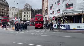 Bus spotters surround old Routemaster no. 16 bus in Victoria Station