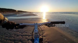 bike ride along the beach along the sea in Jurmala. the sound of sea waves, the cries of seagulls and the sunset soothe and inspire