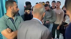 Relatives of Palestinians teenager Mustafa Amer Sabah who was shot killed by Israeli forces during clashes, mourn over his body at a hospital