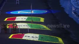 Projection of the Napoli logo and the three championships won in its history on the Posillipo beach. During the preparations for the celebration of the victory of the Italian Serie A championship and the third scudetto