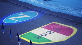 Napoli badge projected onto beach ahead of potential title-winning weekend