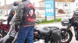 Hells Angels and Red Chief Motorcycle club members ride in Seaside Town, Henver Road, Newquay Cornwall UK