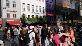Finally the sun comes out as Londoners in the West End of London enjoy the sun in Leicester Square