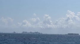 Fighter jets flying in formation off the coast of Florida, and one does a pretty low fly by