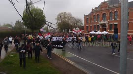 Manchester United supporters march to Old Trafford to protest the ownership of the Glazer family