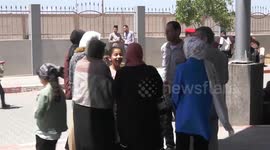 Relatives welcome Palestinian evacuees from war-torn Sudan upon arrival to the Gaza Strip through the Rafah border crossing with Egypt