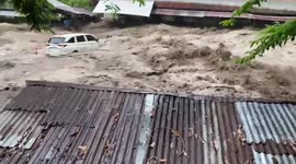 Flash floods ravage Indonesia, wash cars off road