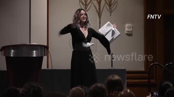 Crowds cheers as woman tears apart Bible during SatanCon held in Boston