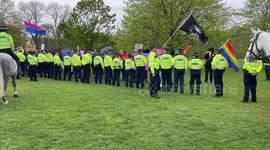 Police separate women's rights and transgender activists during a rally at Speakers' Corner in Hyde Park
