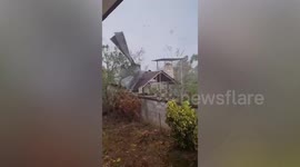 Terrifying winds tear off roofs from families' houses during summer storm in Thailand
