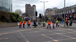 Just Stop Oil cause disruption at roundabout near Waterloo Station in central London on Bank Holiday Monday