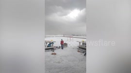 Gusts blow construction crane during storm in Thailand
