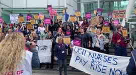 Striking nurses chant at a picket outside University College Hospital in London