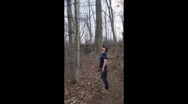 Man climbs an impossibly thin tree and lands on his feet after letting go
