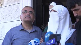 The wife of Khader Adnan, a Palestinian Islamic Jihad who died in Israeli detention after been on hunger strike for nearly three months, delivers a statement at her family home, in the city of Jenin in the West Bank.