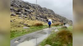 Former soldier climbs three mountains in one day with a 25kg fridge on his back