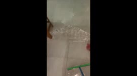 A hysterical housewife found her house flooded due to the heavy rain that hit her roof.
