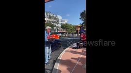 Jay Leno hands out doughnuts to striking members of the Writers Guild of America