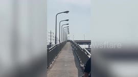 Bungling driver passes through narrow motorcycle ramp before being stuck in middle
