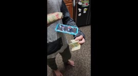 'Keep unwrapping!' - Son receives an early birthday present from playful mother