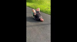 Man finds himself hilariously stuck in a spring seat rocker at a children's playground