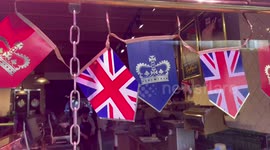 Shops in north London decorate front windows with Coronation items