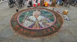 Pavement artist puts finishing touches to chalk portrait of King Charles in London