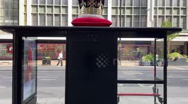 A huge crown adorns a bus stop in Oxford St
