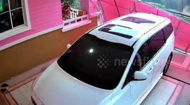 Awning crashes into family's parked car when storm pounds their home