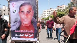 Palestinian workers take part in a march to demand their rights during International Workers' Day also known as Labour Day, in Gaza City