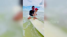 Toddler, 3, seen learning to surf in heartwarming videos taken over two years
