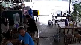 Storm whips through noodle restaurant shaking its walls in Thailand