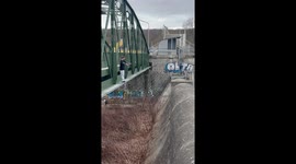 Parkour enthusiast's ANKLE-CRACKING bridge jump ends on a bushy note