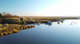 Drone footage of several boats moored on the river Humber at Sunk Island.