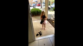 Cute girl shows up to the front door with a wild duck in hands