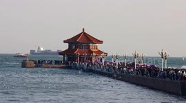 Tourists At The Trestle Bridge Scenic Spot in Qingdao, China
